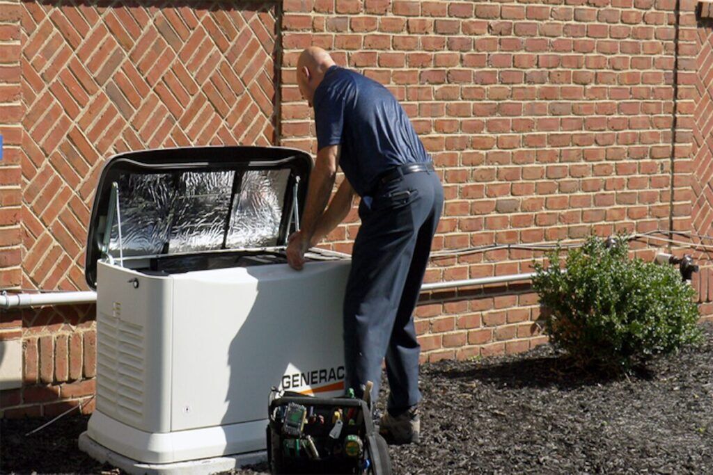 Tech installing a Generac generator